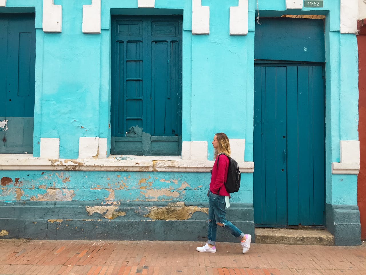 Woman traveler confidently walking down a Colombian street